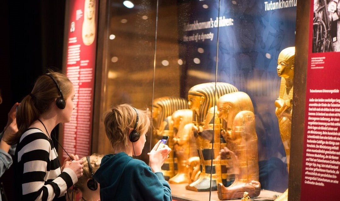 Children experiencing Tutankhamun: His Tomb and His Treasures exhibition