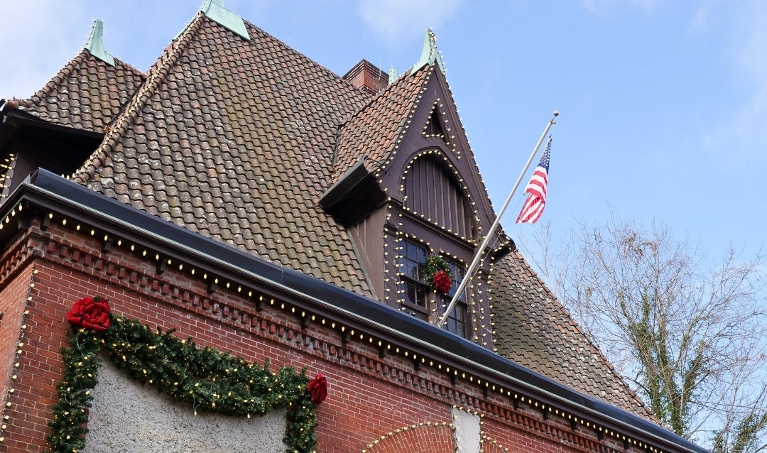 Lodge Gate decorated for Christmas during Biltmore's recovery from Helene.